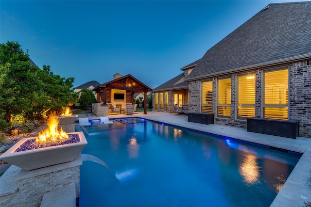 15186 Crape Myrtle Rd, Frisco, TX 75035 - swimming pool featuring an outdoor fire pit, a patio area, an outdoor bar, and a gazebo