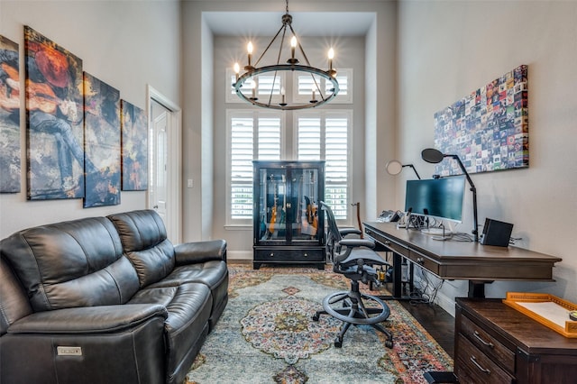 15186 Crape Myrtle Rd, Frisco, TX 75035 - office with a chandelier, wood finished floors, baseboards, and a high ceiling