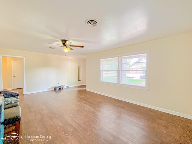 3816 State St, Abilene, TX 79603 - unfurnished living room featuring light wood-style flooring, a ceiling fan, and baseboards