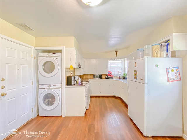 3816 State St, Abilene, TX 79603 - washroom with stacked washer / dryer and light wood-style floors