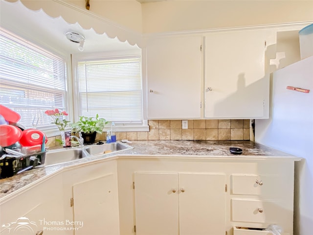 3816 State St, Abilene, TX 79603 - kitchen with white cabinetry, tasteful backsplash, and light countertops