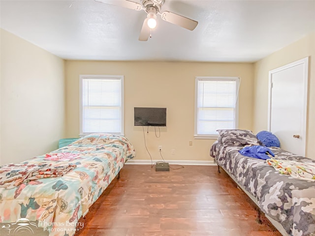 3816 State St, Abilene, TX 79603 - bedroom featuring wood finished floors, baseboards, and a ceiling fan