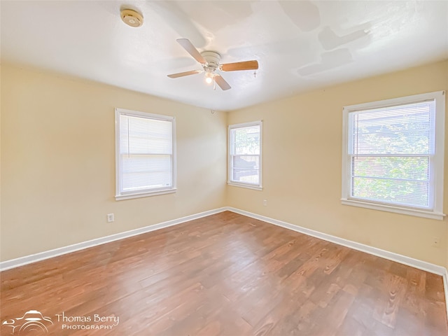 3816 State St, Abilene, TX 79603 - spare room with baseboards, wood finished floors, a ceiling fan, and a smoke detector