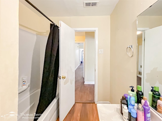 3816 State St, Abilene, TX 79603 - full bathroom with wood finished floors and shower / bath combo