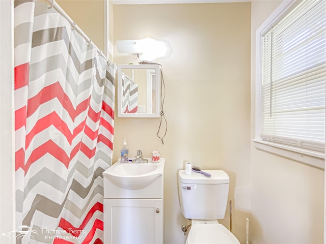3816 State St, Abilene, TX 79603 - bathroom featuring vanity, toilet, and curtained shower
