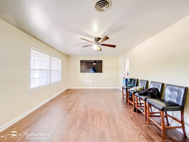 3816 State St, Abilene, TX 79603 - living area featuring wood finished floors, a ceiling fan, and baseboards