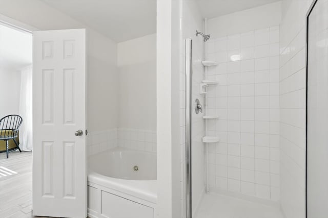 216 Hilltop Dr, Justin, TX 76247 - full bath featuring a jetted tub, a shower stall, and wood finished floors