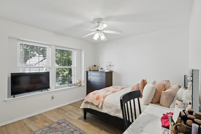 216 Hilltop Dr, Justin, TX 76247 - bedroom with wood finished floors, baseboards, and ceiling fan