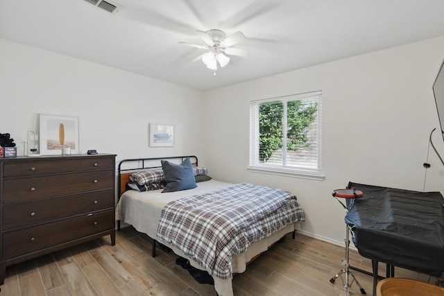 216 Hilltop Dr, Justin, TX 76247 - bedroom featuring light wood-type flooring, a ceiling fan, and baseboards
