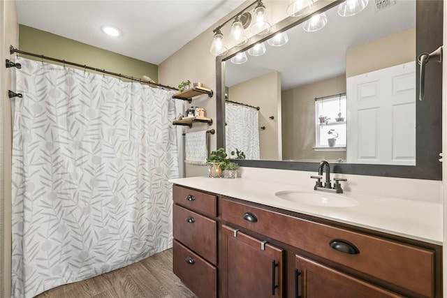 9104 Lookout Pt, Fort Worth, TX 76179 - full bathroom with wood finished floors, vanity, and a shower with curtain
