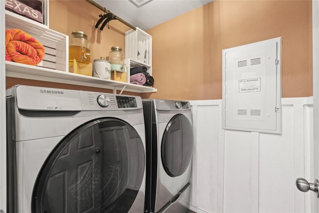 9104 Lookout Pt, Fort Worth, TX 76179 - laundry room with washing machine and clothes dryer and a wainscoted wall