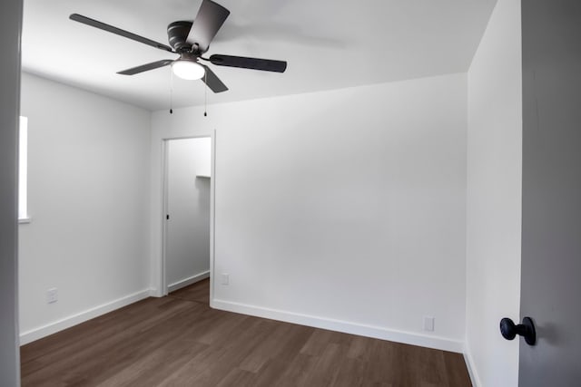 1538 N Hill Ave, Tyler, TX 75702 - spare room with a ceiling fan, dark wood-type flooring, and baseboards