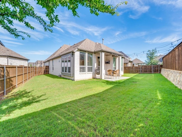 2724 Eccleston St, Celina, TX 75009 - back of house with brick siding and a patio
