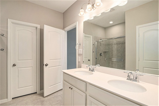 2535 Candle Ln, Northlake, TX 76247 - bathroom with a shower stall, double vanity, and tile patterned flooring