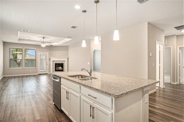 2535 Candle Ln, Northlake, TX 76247 - kitchen with a sink, dishwasher, dark wood finished floors, a tray ceiling, and recessed lighting
