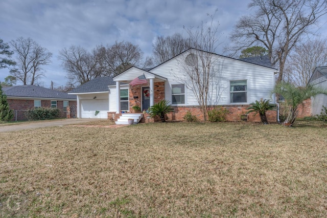 444 Albert Ave, Shreveport, LA 71105 - view of front of house with an attached garage, brick siding, concrete driveway, and a front yard