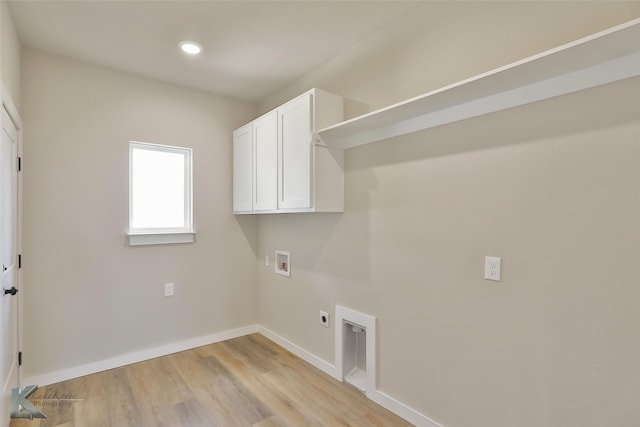 3458 Pewter Ln, Abilene, TX 79601 - washroom featuring hookup for a washing machine, cabinet space, electric dryer hookup, light wood-style floors, and baseboards