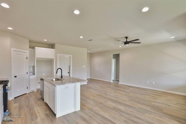 3458 Pewter Ln, Abilene, TX 79601 - kitchen featuring a sink, dishwasher, white cabinets, light stone countertops, and ceiling fan