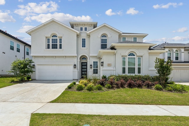 12469 Diamond Creek Dr, Frisco, TX 75035 - mediterranean / spanish-style house with an attached garage, a front yard, driveway, and stucco siding