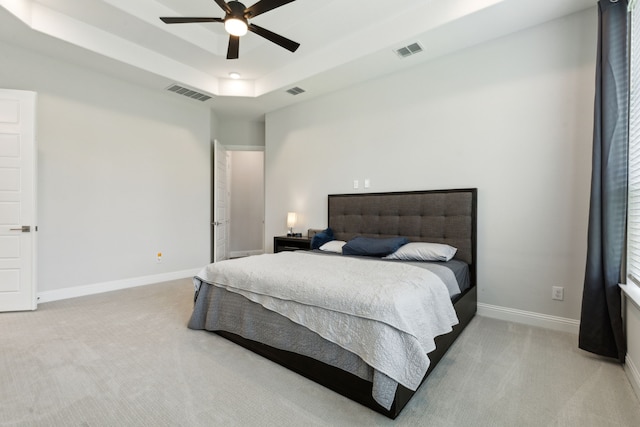 12469 Diamond Creek Dr, Frisco, TX 75035 - bedroom with light colored carpet, a raised ceiling, and baseboards