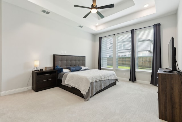 12469 Diamond Creek Dr, Frisco, TX 75035 - bedroom with baseboards, light colored carpet, a tray ceiling, a ceiling fan, and recessed lighting