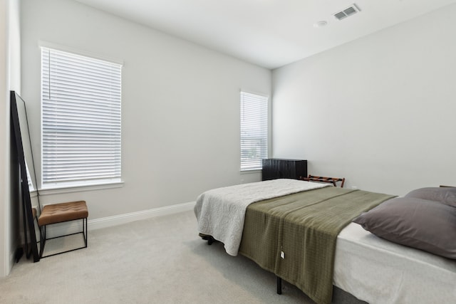 12469 Diamond Creek Dr, Frisco, TX 75035 - bedroom featuring light carpet, multiple windows, and baseboards