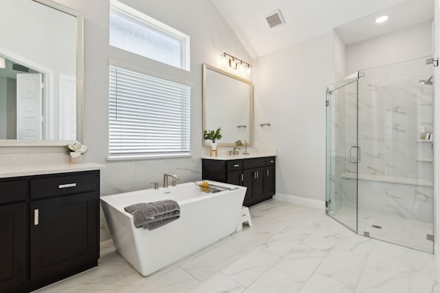 12469 Diamond Creek Dr, Frisco, TX 75035 - full bath featuring marble finish floors, a marble finish shower, vanity, a freestanding bath, and lofted ceiling