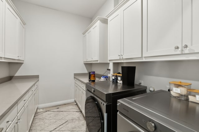 12469 Diamond Creek Dr, Frisco, TX 75035 - washroom with cabinet space, separate washer and dryer, and baseboards