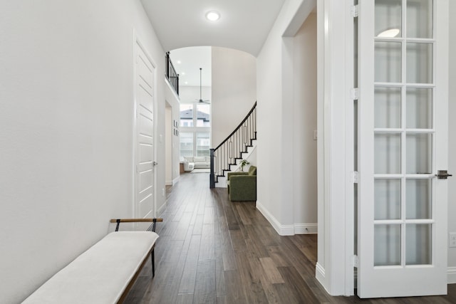 12469 Diamond Creek Dr, Frisco, TX 75035 - hallway featuring arched walkways, stairs, dark wood-type flooring, baseboards, and recessed lighting