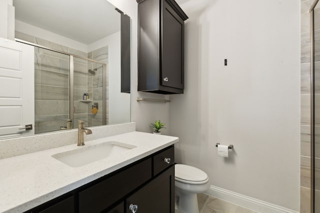 12469 Diamond Creek Dr, Frisco, TX 75035 - full bathroom featuring toilet, vanity, a stall shower, and baseboards