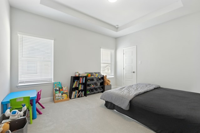 12469 Diamond Creek Dr, Frisco, TX 75035 - carpeted bedroom with a tray ceiling and baseboards