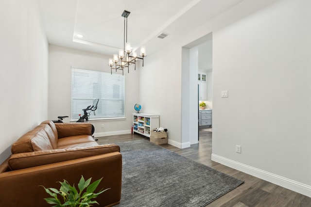 12469 Diamond Creek Dr, Frisco, TX 75035 - living area featuring a chandelier, dark wood-style flooring, baseboards, recessed lighting, and a raised ceiling