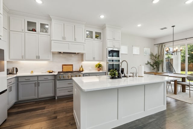 12469 Diamond Creek Dr, Frisco, TX 75035 - kitchen featuring gray cabinets, stainless steel appliances, light countertops, recessed lighting, and tasteful backsplash