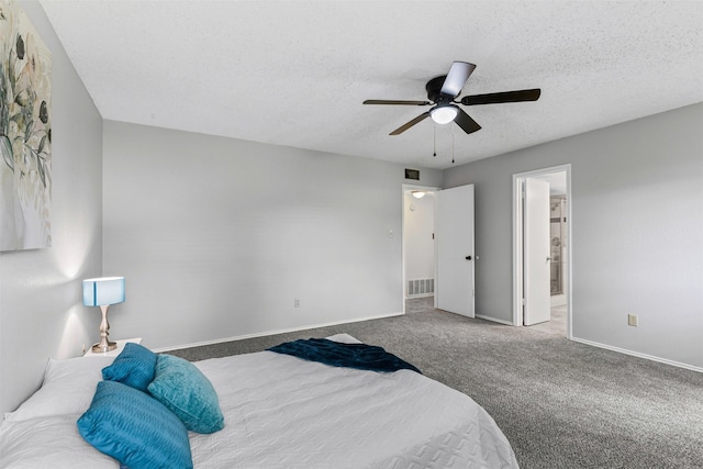 4910 Crest Dr, Arlington, TX 76017 - bedroom with a textured ceiling, carpet flooring, baseboards, ceiling fan, and ensuite bath