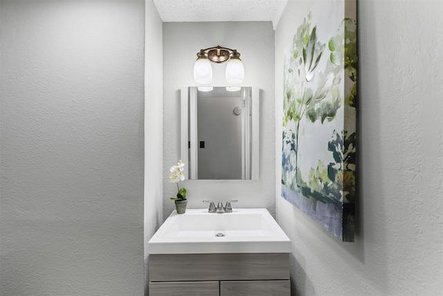4910 Crest Dr, Arlington, TX 76017 - bathroom featuring a textured wall and vanity