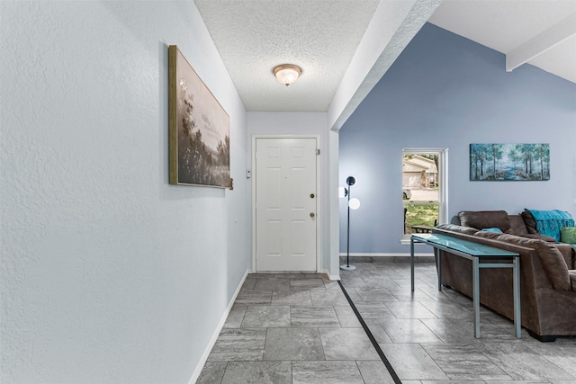 4910 Crest Dr, Arlington, TX 76017 - entrance foyer with baseboards, a textured ceiling, and light stone finish floors