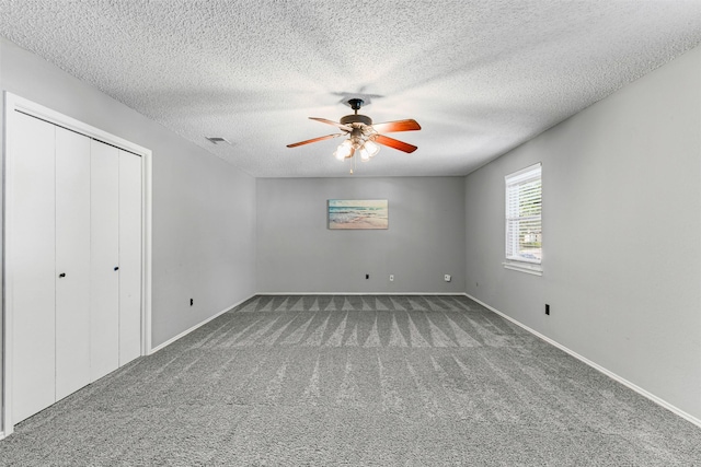 4910 Crest Dr, Arlington, TX 76017 - unfurnished bedroom with carpet flooring, a textured ceiling, baseboards, and a closet
