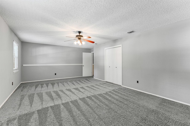 4910 Crest Dr, Arlington, TX 76017 - empty room with carpet floors, ceiling fan, a textured ceiling, and baseboards