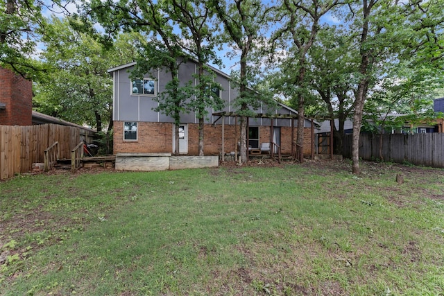4910 Crest Dr, Arlington, TX 76017 - rear view of house with brick siding
