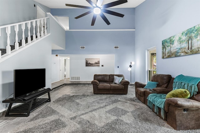 4910 Crest Dr, Arlington, TX 76017 - living room featuring high vaulted ceiling, ceiling fan, baseboards, and stairs