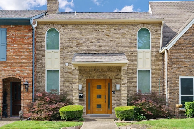 6853 Anglebluff Cir, Dallas, TX 75248 - view of front of property with a chimney, brick siding, and roof with shingles