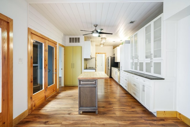 6853 Anglebluff Cir, Dallas, TX 75248 - kitchen with dark wood finished floors, glass insert cabinets, white cabinetry, and wood ceiling