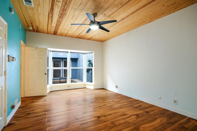 6853 Anglebluff Cir, Dallas, TX 75248 - unfurnished room featuring wood ceiling, a ceiling fan, wood finished floors, and baseboards