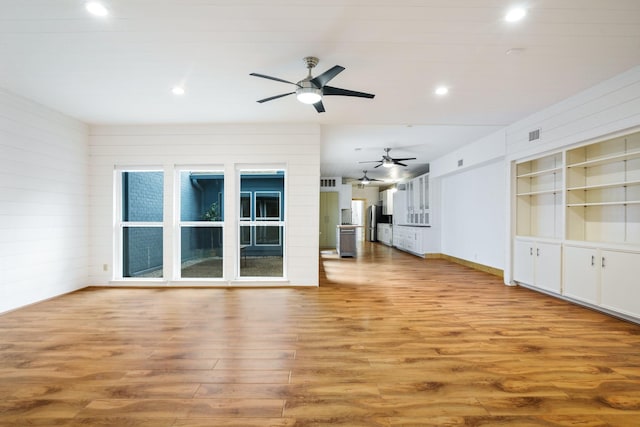 6853 Anglebluff Cir, Dallas, TX 75248 - unfurnished living room with ceiling fan, wood finished floors, recessed lighting, built in shelves, and baseboards