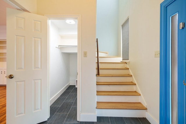 6853 Anglebluff Cir, Dallas, TX 75248 - stairs featuring baseboards and wood tiled floors