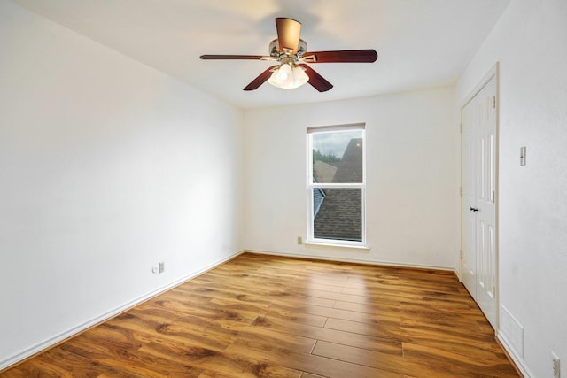 6853 Anglebluff Cir, Dallas, TX 75248 - empty room featuring wood finished floors, a ceiling fan, and baseboards