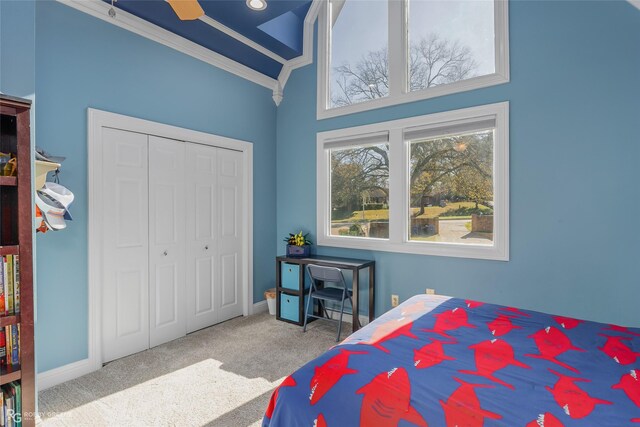 5607 S Lakeshore Dr, Shreveport, LA 71119 - carpeted bedroom with a closet, baseboards, and crown molding