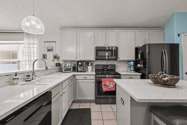 1521 Cherokee Rose Trl, Savannah, TX 76227 - kitchen featuring range with gas cooktop, stainless steel microwave, freestanding refrigerator, dishwasher, and a sink