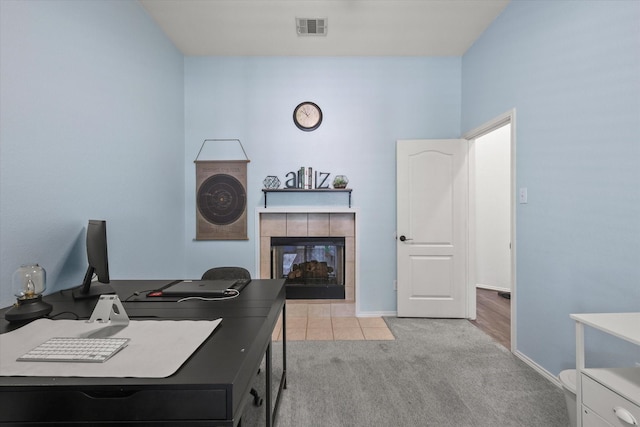 1521 Cherokee Rose Trl, Savannah, TX 76227 - office area with a tile fireplace, light carpet, baseboards, and light tile patterned floors
