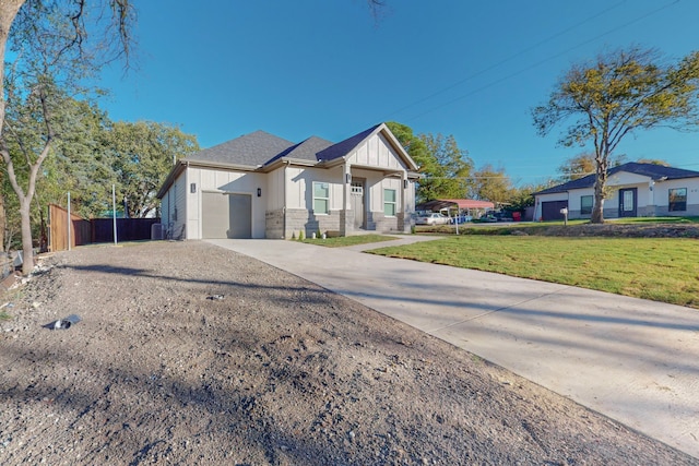 400 N Kenny Dr, West Tawakoni, TX 75474 - view of front facade with an attached garage, driveway, and board and batten siding